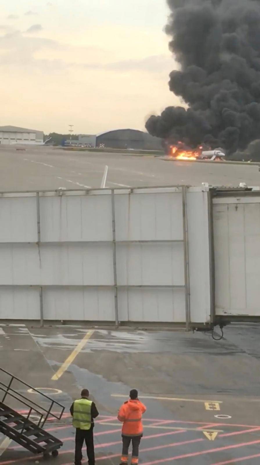 Smoke billows from a Russian Aeroflot passenger plane on fire after it made an emergency landing at Sheremetyevo International Airport, Moscow