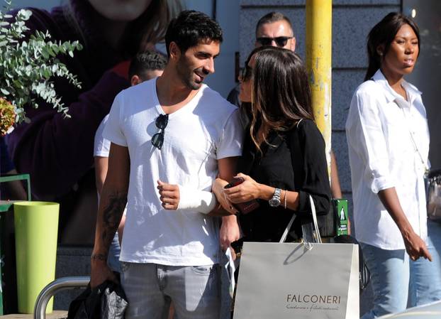 Milan, Filippo Magnini and Giorgia Palmas shopping at Falconeri