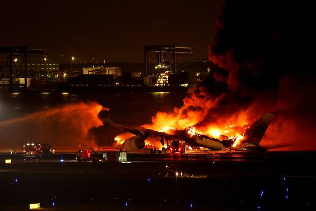 Japan Airlines' A350 airplane on fire at Haneda International Airport in Tokyo