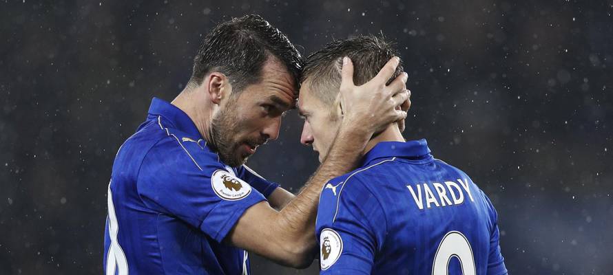 Leicester City's Jamie Vardy celebrates scoring their first goal with Christian Fuchs