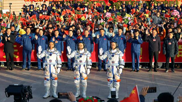 Chinese astronauts Tang Hongbo, Tang Shengjie and Jiang Xinlin of Shenzhou-17 mission attend a ceremony at Jiuquan Satellite Launch Center