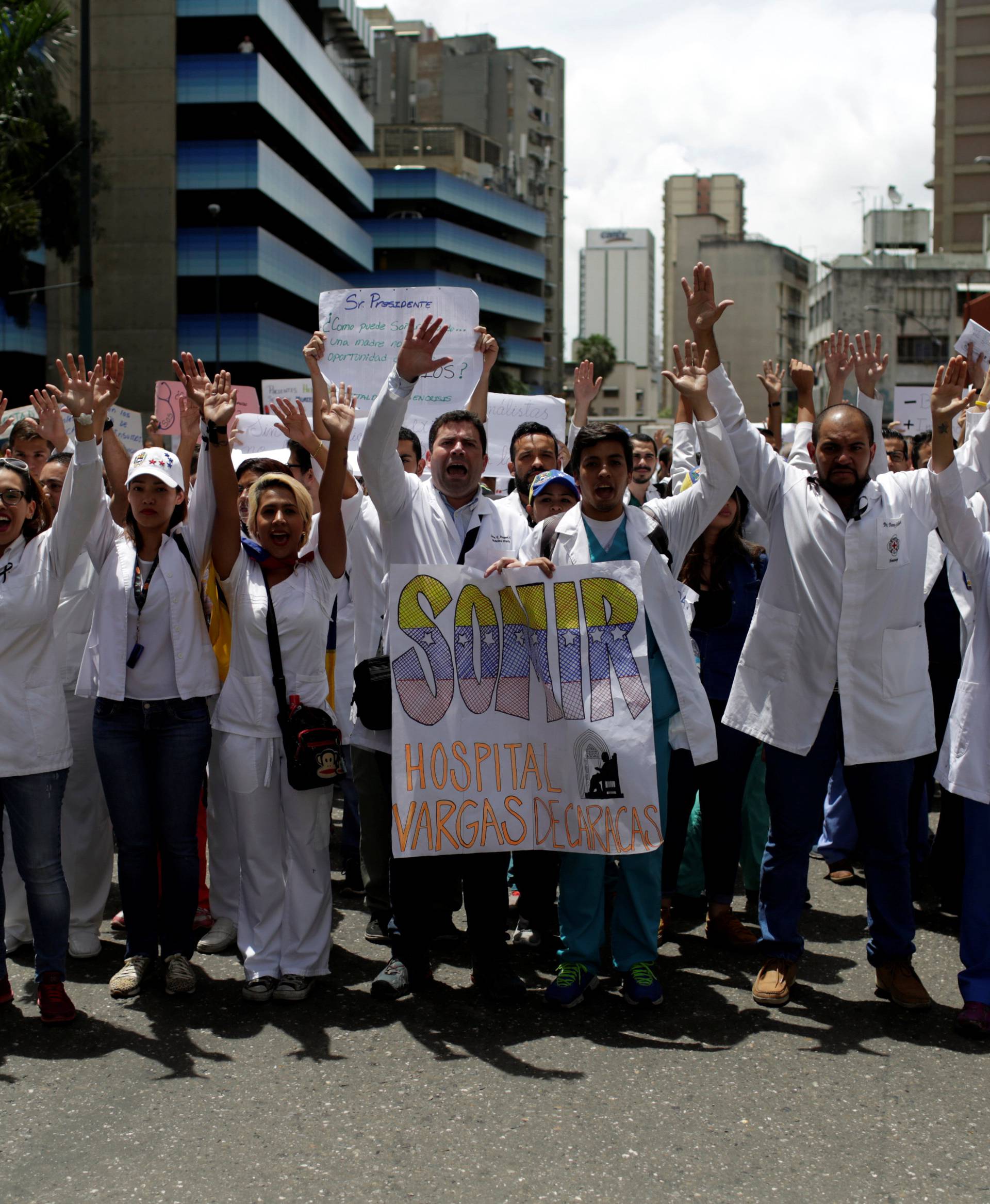 Workers of the health sector and opposition supporters take part in a protest against President Nicolas Maduro's government in Caracas