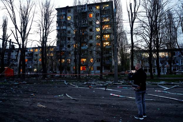 Rescuers work at the site of a Russian missile strike, amid Russia's attack on Ukraine, in Kyiv