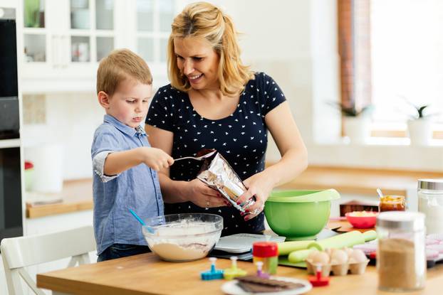 Happy mother and child in kitchen