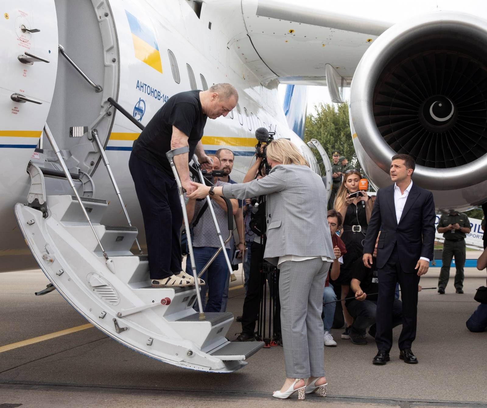 Ukraine's President Volodymyr Zelensky welcomes recently exchanged Ukrainian prisoners upon arrival at Boryspil International Airport, outside Kiev