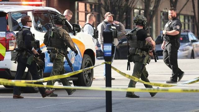 Police deploy at the scene of a mass shooting near Slugger Field baseball stadium in downtown Louisville