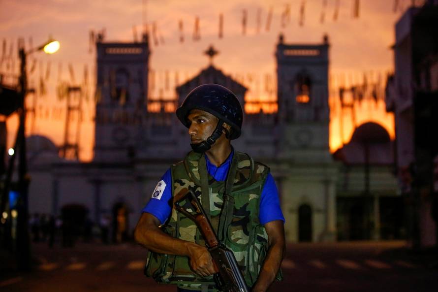 A security officer stands guard outside St. Antony's Shrine in Colombo
