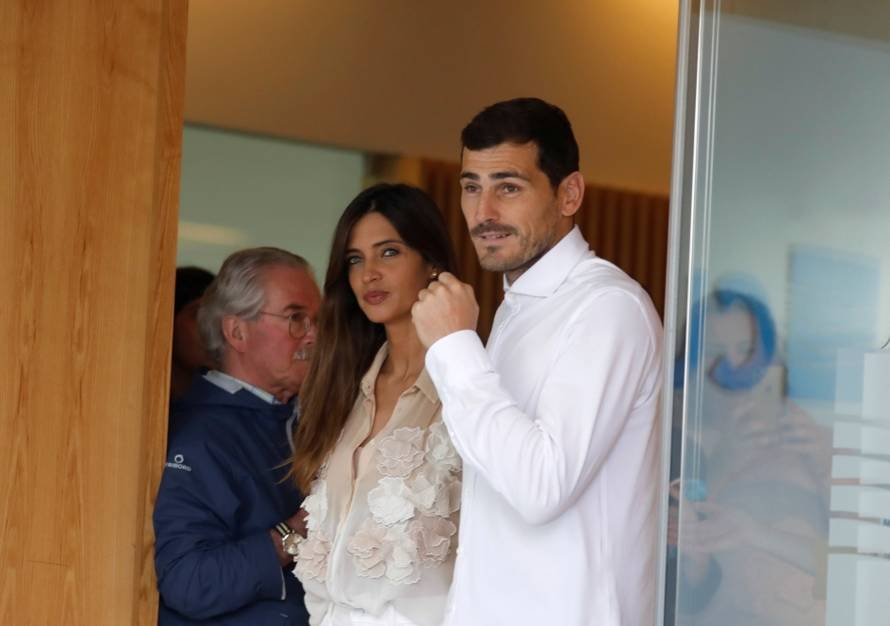Spanish soccer player Iker Casillas leaves CUF Porto hospital accompanied by his wife Sara Carbonero in Porto
