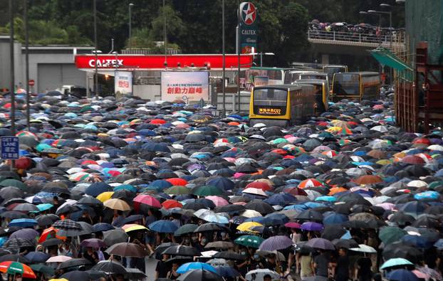 People march during a rally to demand democracy and political reforms in Hong Kong