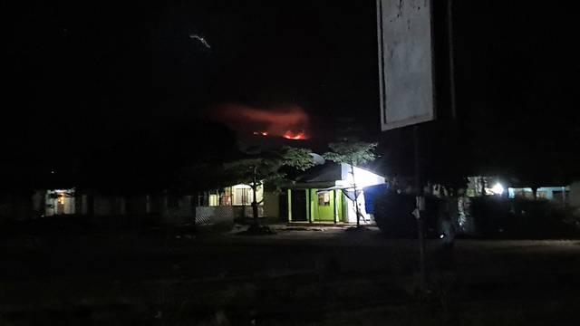 View of fire's glow on Mt Kilimanjaro seen from Moshi