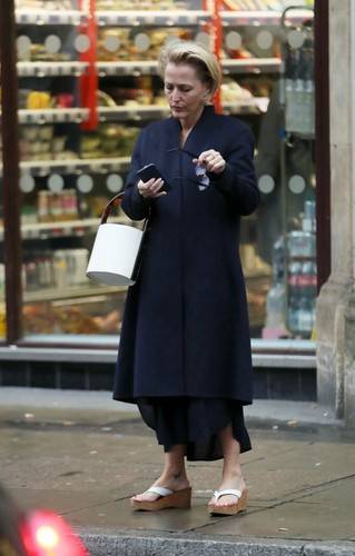 *EXCLUSIVE* Former X-Files star Gillian Anderson looking a little pre-occupied on her phone outside Sainsbury's in London.
