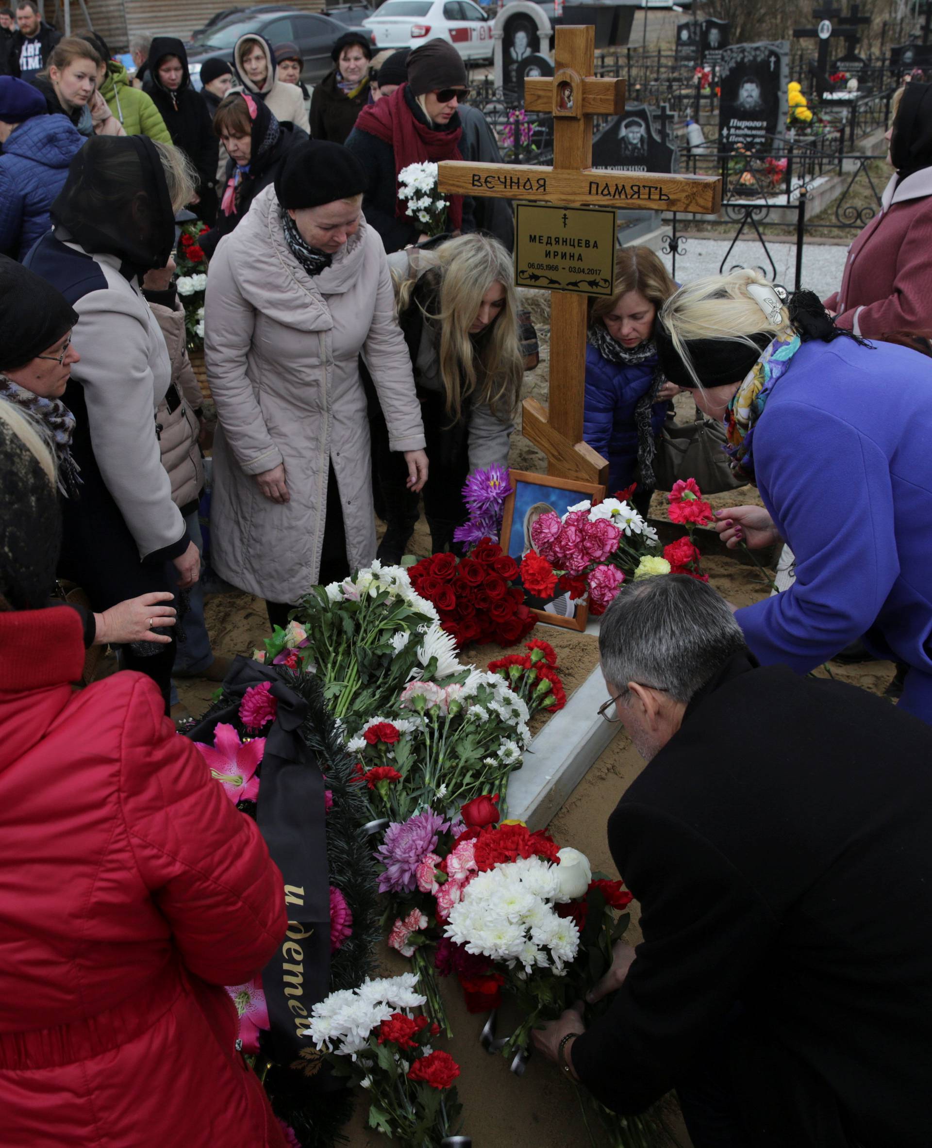 Relatives and friends attend a funeral of Medyantseva, victim of the St. Petersburg metro blast, at the cemetery in the town of Dzerzhinsky