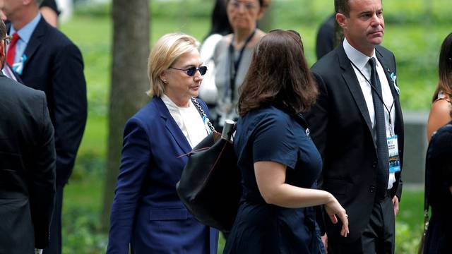 U.S. Democratic presidential candidate Hillary Clinton arrives for ceremonies to mark the 15th anniversary of the September 11 attacks at the National 9/11 Memorial in New York
