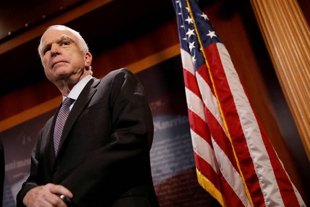 FILE PHOTO:    Senator John McCain (R-AZ) looks on during a press conference about his resistance to the so-called "Skinny Repeal" of the Affordable Care Act on Capitol Hill in Washington