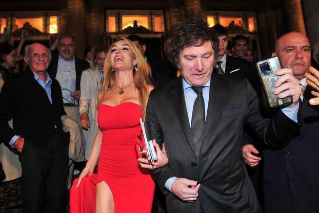 Argentine presidential candidate Javier Milei arrives at the Teatro Colon opera house with his girlfriend, Fatima Florez, ahead of the November 19 runoff elections