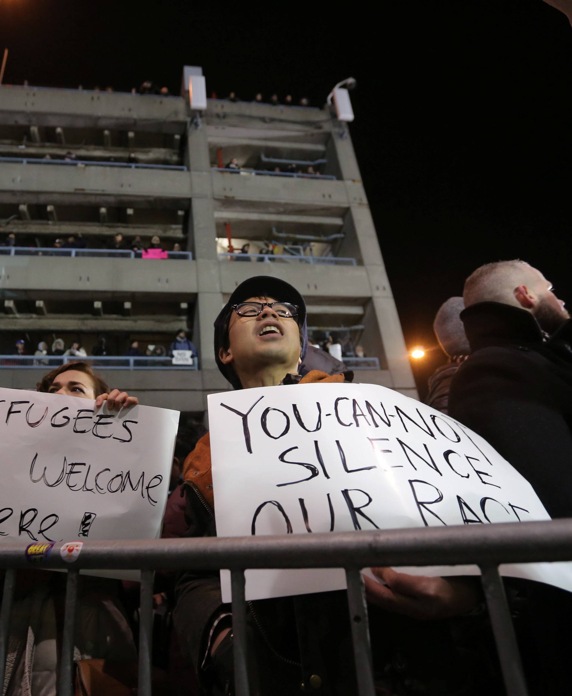 Protesters gather outside Terminal 4 at JFK airport in opposition to U.S. president Donald Trump's proposed ban on immigration in Queens, New York City, U.S.