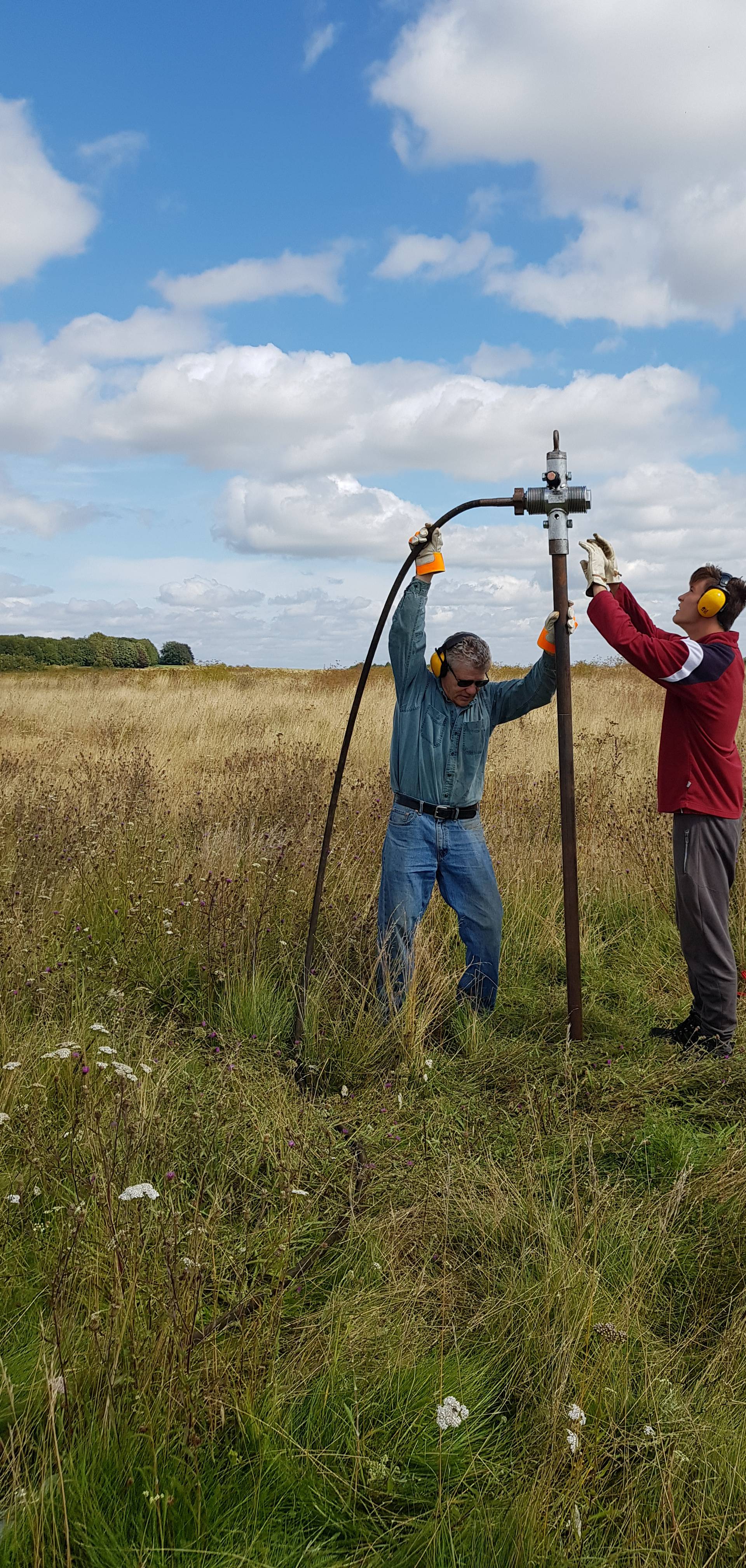 Members of the consortium which made the discovery of a wide circle of deep pits, as part of the Stonehenge Hidden Landscapes Project, conduct fieldwork in Durrington, Wiltshire