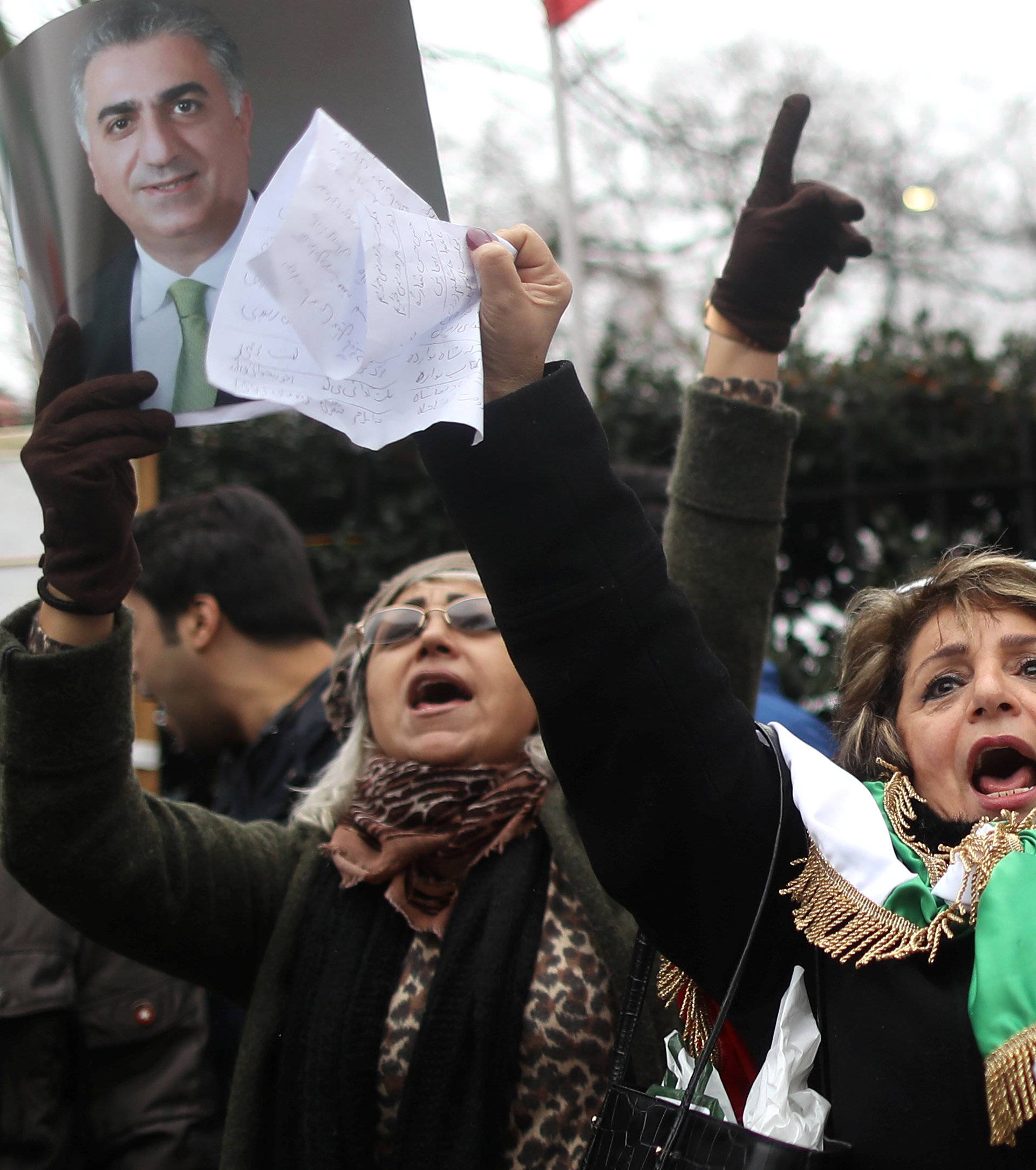 Opponents of Iranian President Hassan Rouhani hold a protest outside the Iranian embassy in west London