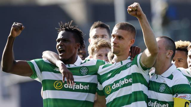 Celtic's Jozo Simunovic celebrates scoring their first goal with Dedryck Boyata