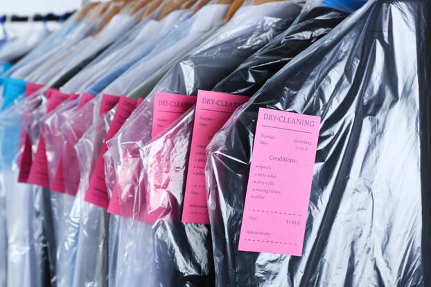 Rack,Of,Clean,Clothes,Hanging,On,Hangers,At,Dry-cleaning