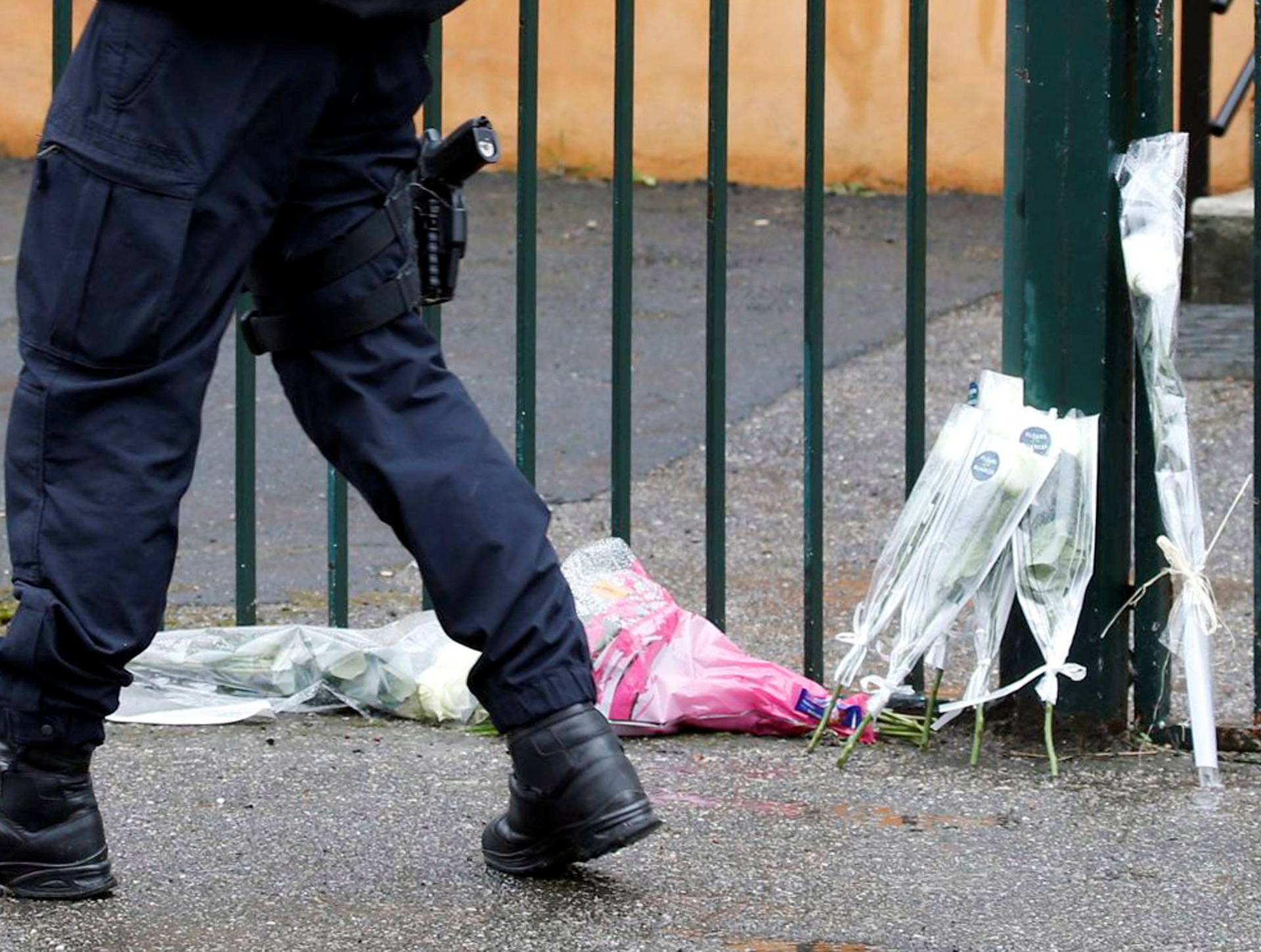 Flowers and messages in tribute to the victim are seen in front of the Gendarmerie of Carcassonne