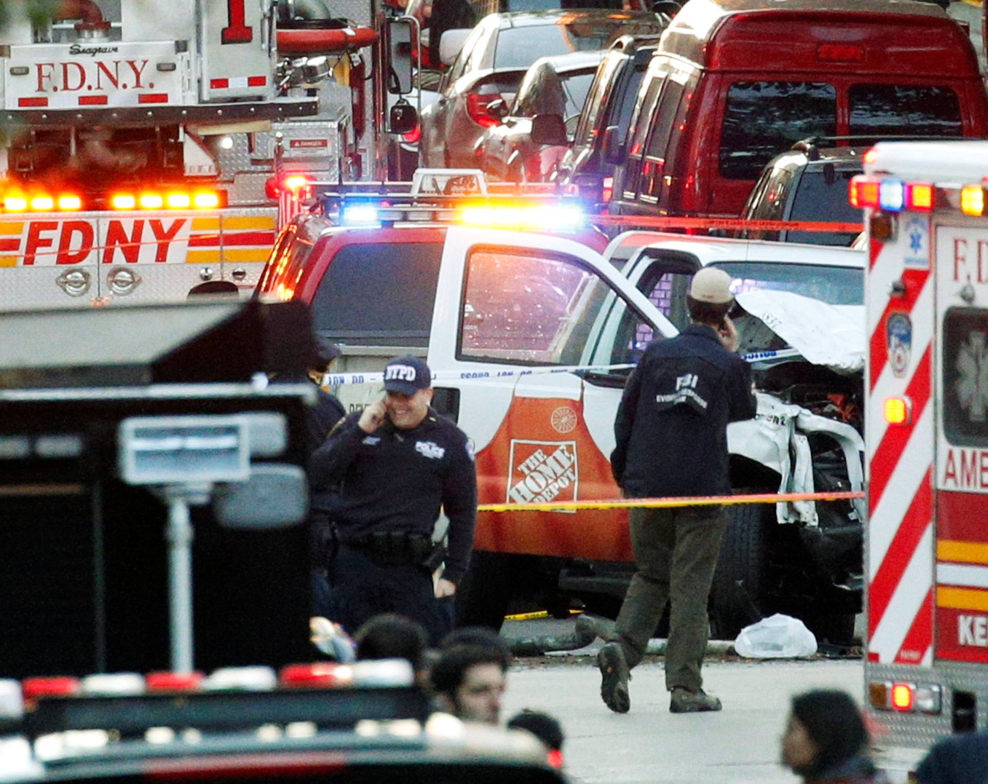 Investigators are near the Home Depot truck which struck down multiple people on a bike path, killing several and injuring numerous others at the crime scene in lower Manhattan in New York