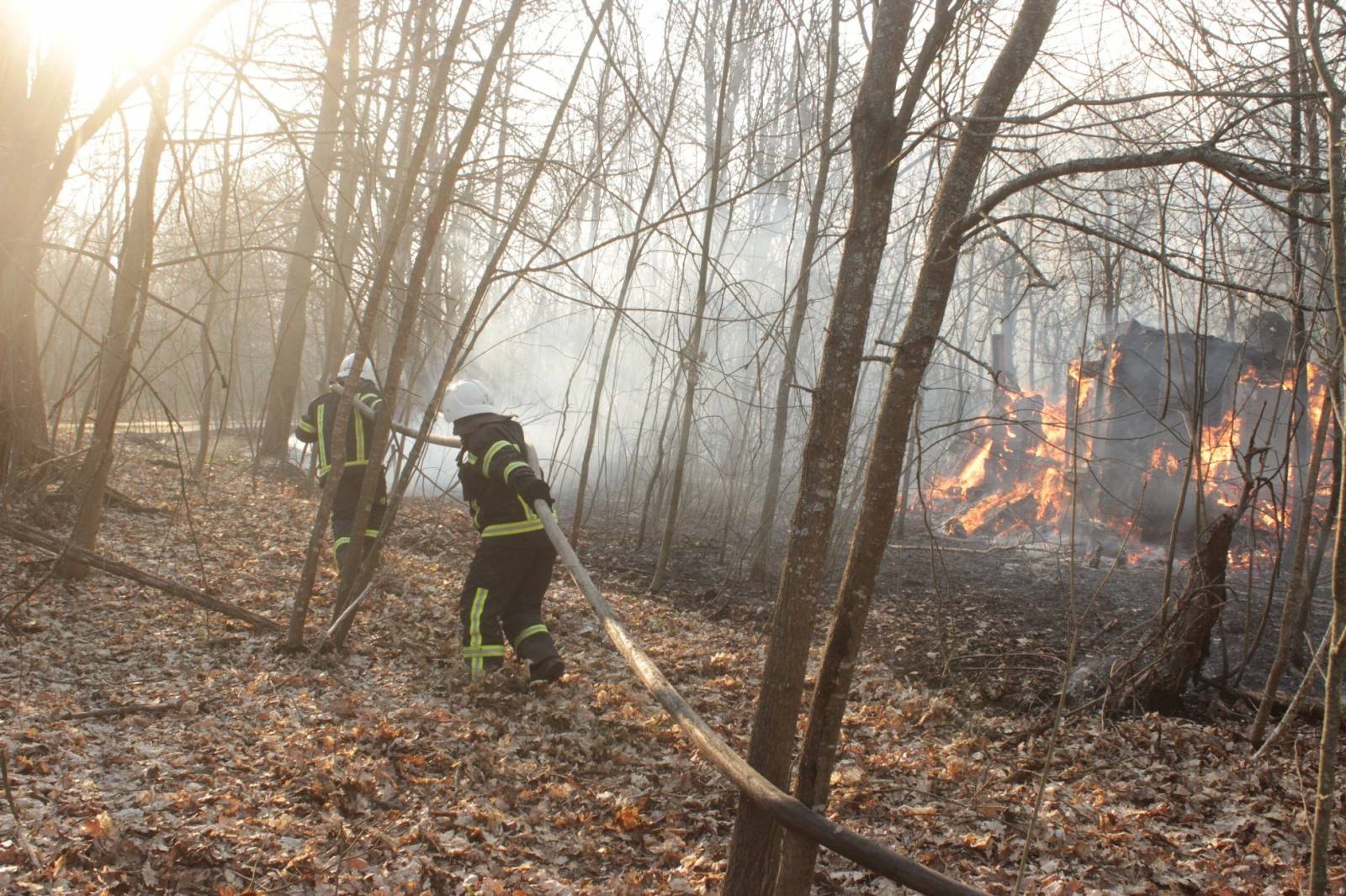 Firefighters try to extinguish a fire burning in the exclusion zone around the Chernobyl nuclear power plant, in Kiev region