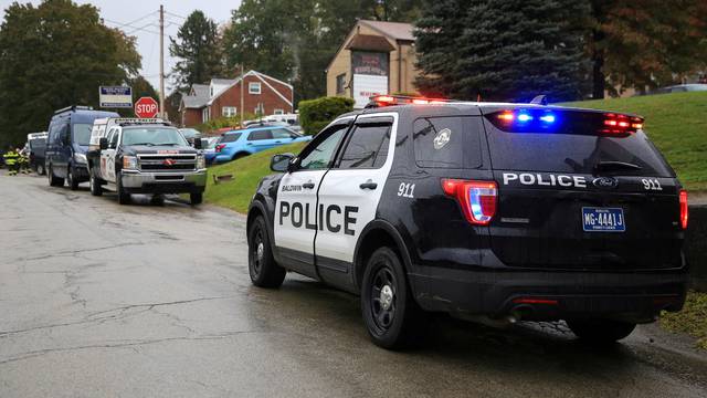 FILE PHOTO: Police vehicles are deployed near the vicinity of the home of Pittsburgh synagogue shooting suspect Robert Bowers' home in Baldwin borough suburb of Pittsburgh