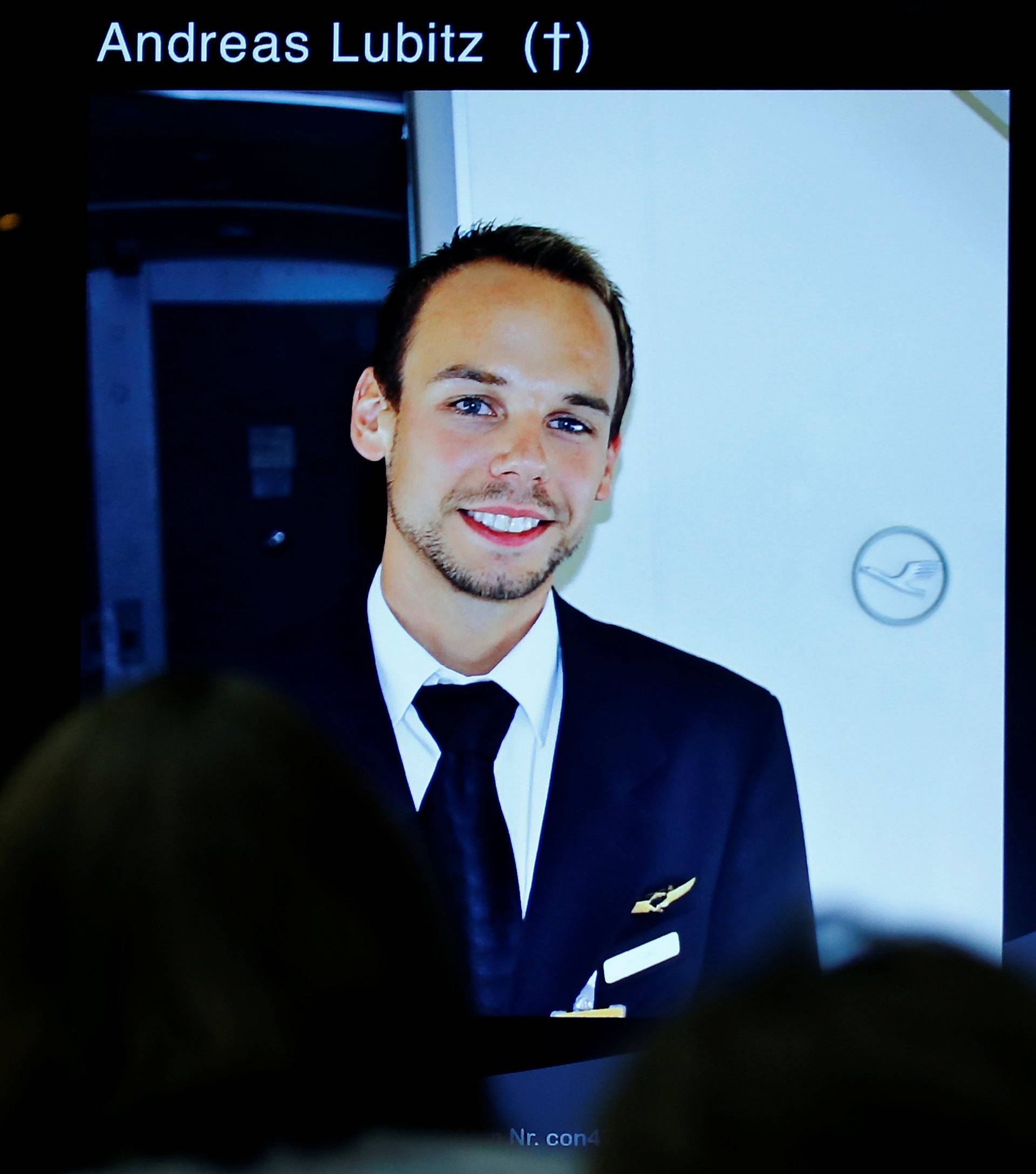 A screen shows a picture of Andreas Lubitz during news conference of Guenter Lubitz in Berlin