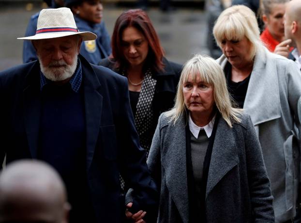 Barry Steenkamp, father of Reeva Steenkamp, arrives with his wife June Steenkamp for the sentencing of former Paralympian Oscar Pistorius at the Pretoria High Court