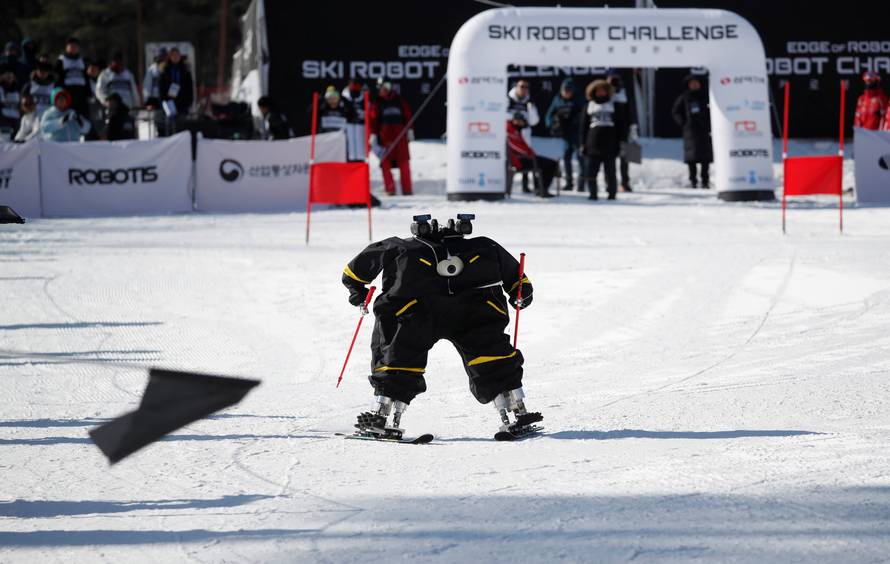 Robot Alexi skies during the Ski Robot Challenge at a ski resort in Hoenseong