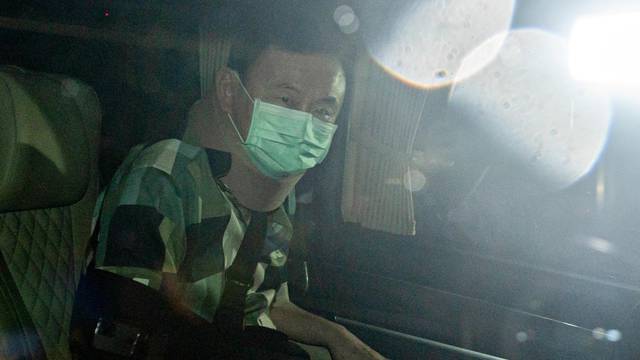 Thailand's former PM Thaksin Shinawatra leaves a police hospital after being granted parole, in Bangkok