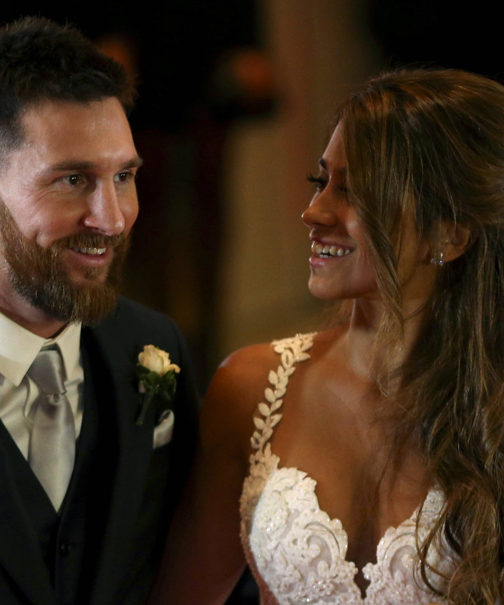Argentine soccer player Lionel Messi and his wife Antonela Roccuzzo pose at their wedding in Rosario, Argentina