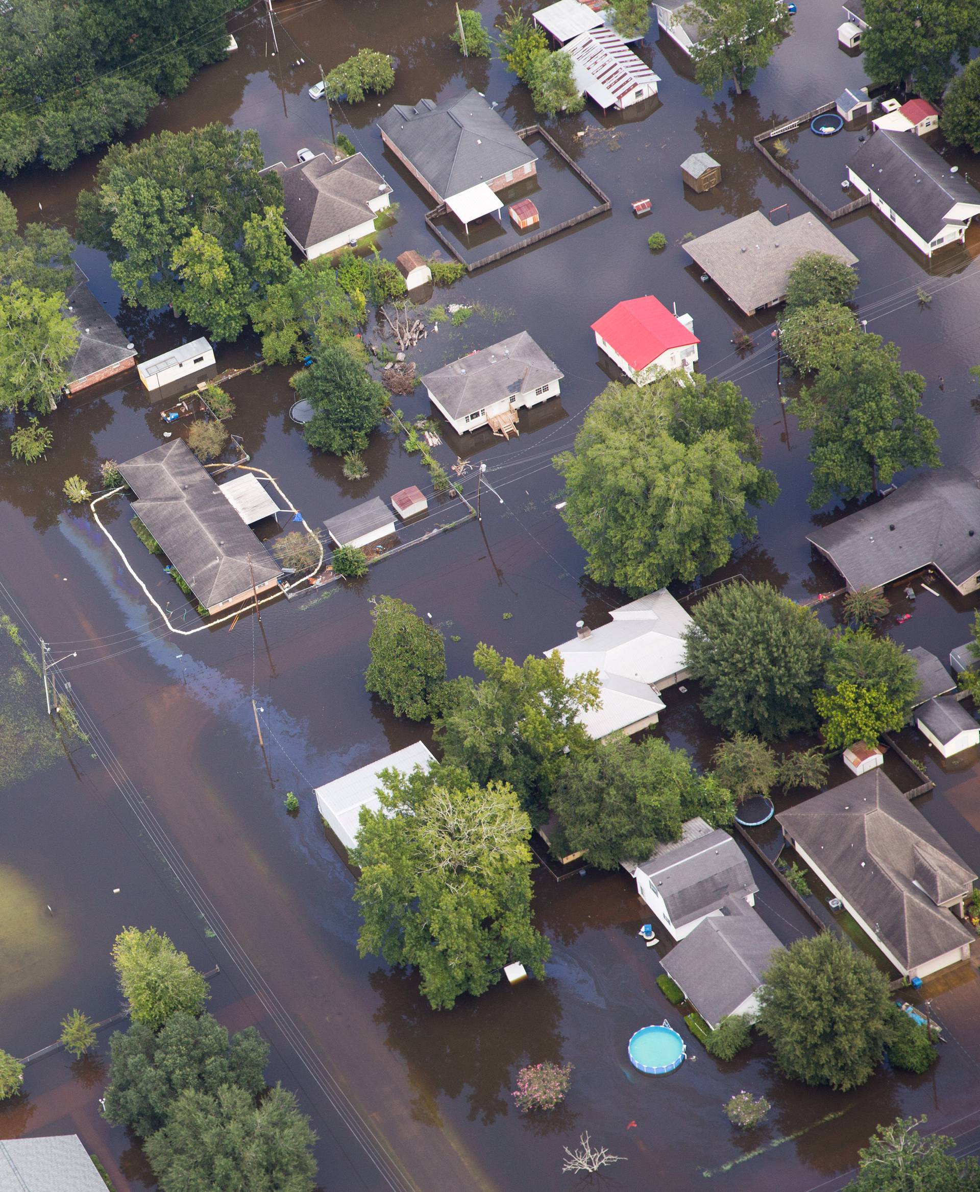 Contaminated floodwaters impact a neighborhood as seen in an aerial view in Sorrento, Louisiana