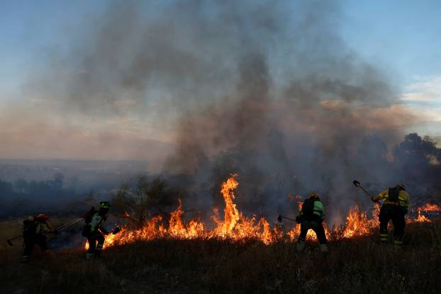 A wildfire burns on the outskirts of Valmojado