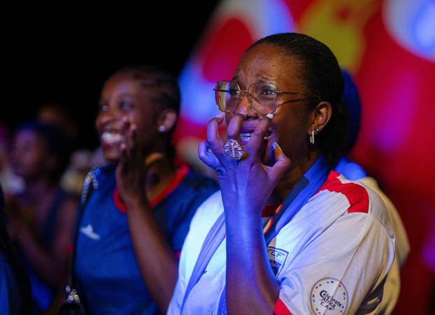 Fans of the Cape Verde national soccer team celebrate as they watch a World Cup group stage match against Uruguay in Praia