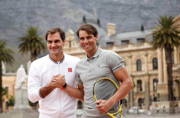 FILE PHOTO: Roger Federer and Rafael Nadal pose for photographers ahead of their "Match in Africa" exhibition tennis match in Cape Town