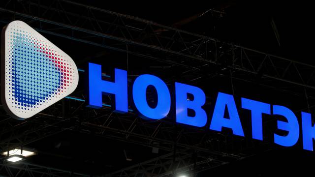 FILE PHOTO: The logo of Russian gas producer Novatek is seen on a board in St. Petersburg