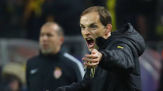 Borussia Dortmund coach Thomas Tuchel celebrates after Borussia Dortmund's Ousmane Dembele scored their first goal as Monaco coach Leonardo Jardim looks on