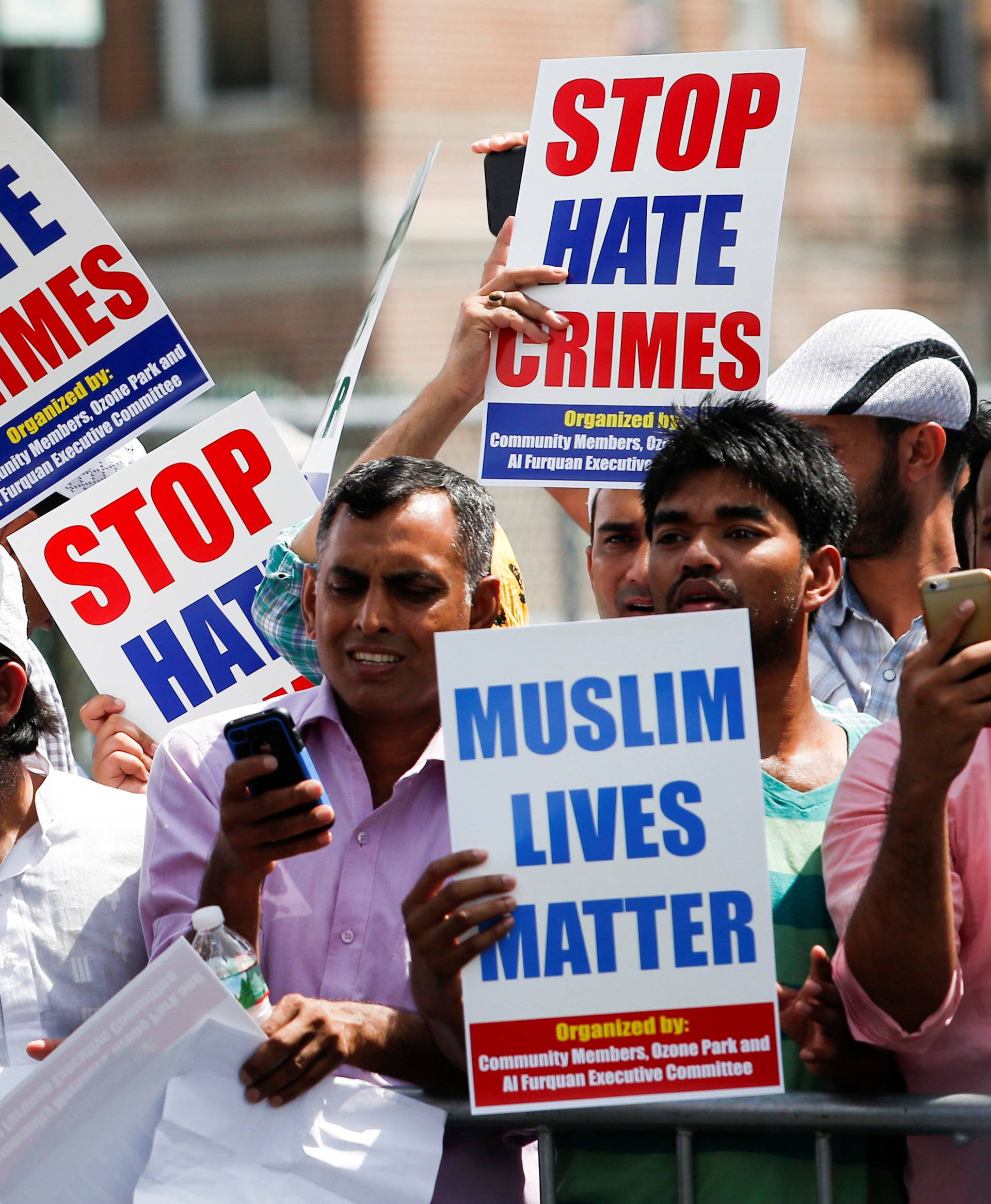 Community members take part in a protest to demand stop hate crime during the funeral service of Maulama Akonjee, and Uddin in the Queens borough of New York City