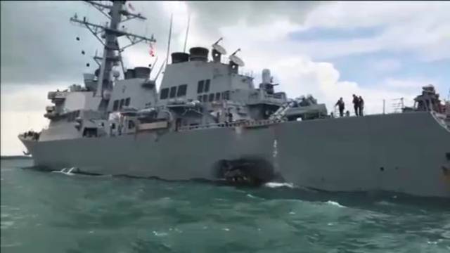 The U.S. Navy guided-missile destroyer USS John S. McCain is seen after a collision, in Singapore waters in this still frame taken from video