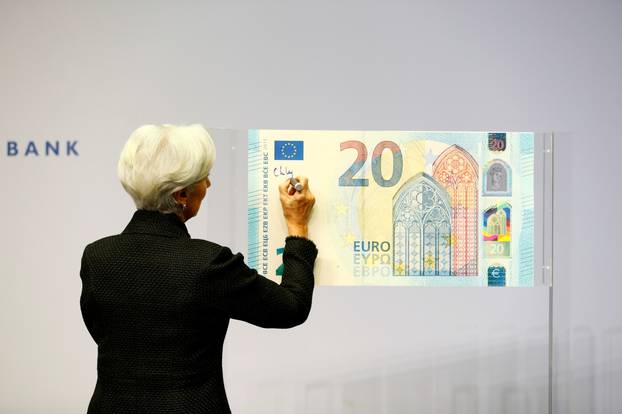 FILE PHOTO: FILE PHOTO: European Central Bank (ECB) President Lagarde gives a signature for newly printed euro banknotes in Frankfurt