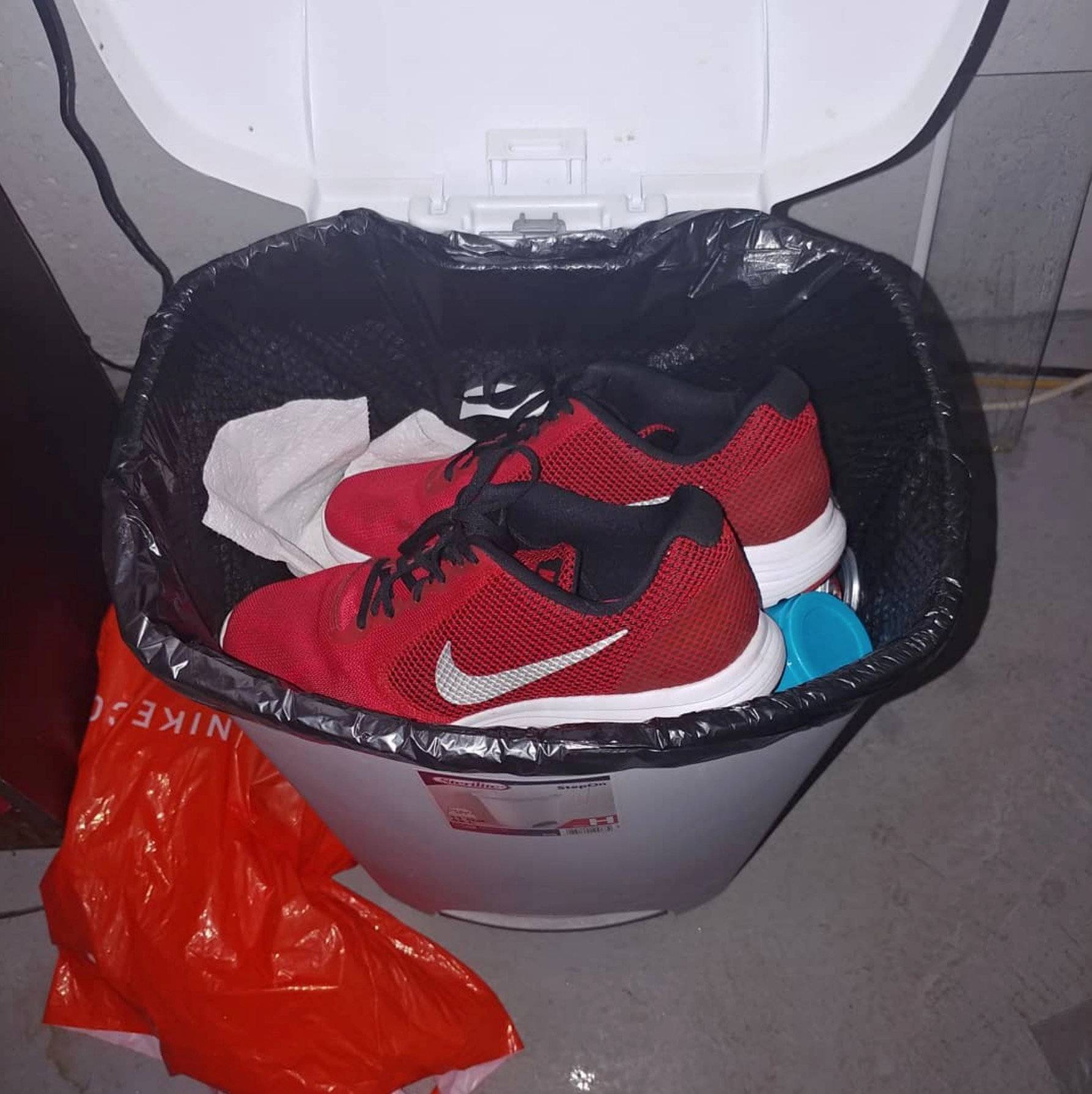 Nike sneakers are seen in the garbage bin in Oklahoma