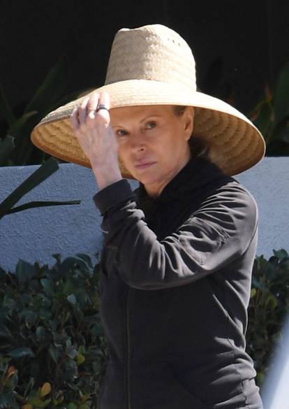EXCLUSIVE: Kim Basinger goes makeup free in her favorite wide brim sun hat as she steps out in LA weeks before making big red carpet return at glitzy LA event.
