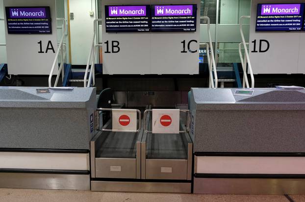 Monarch Airlines check-in desks stand empty after the airline ceased trading at Birmingham Airport