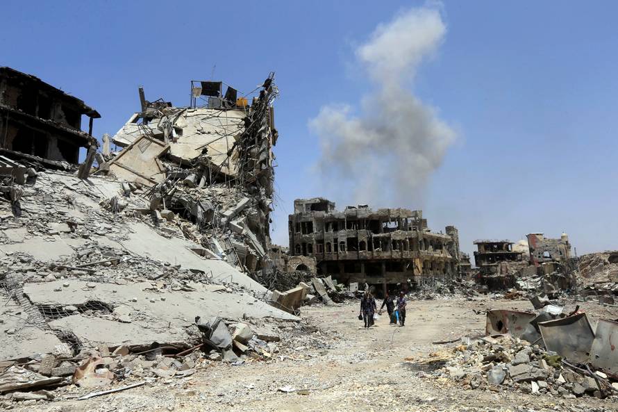 Smoke rises from an air strike in the Old City of Mosul