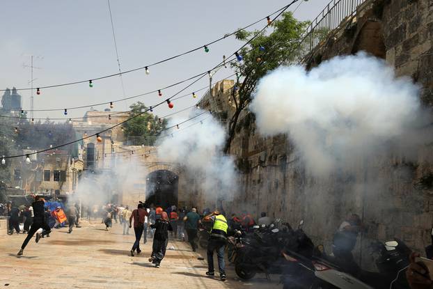 Israeli police clash with Palestinians at the compound that houses Al-Aqsa Mosque in Jerusalem