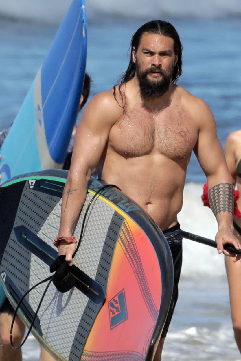 EXCLUSIVE: Aquaman star Jason Momoa shows off his ripped body as he hits the surf in Hawaii