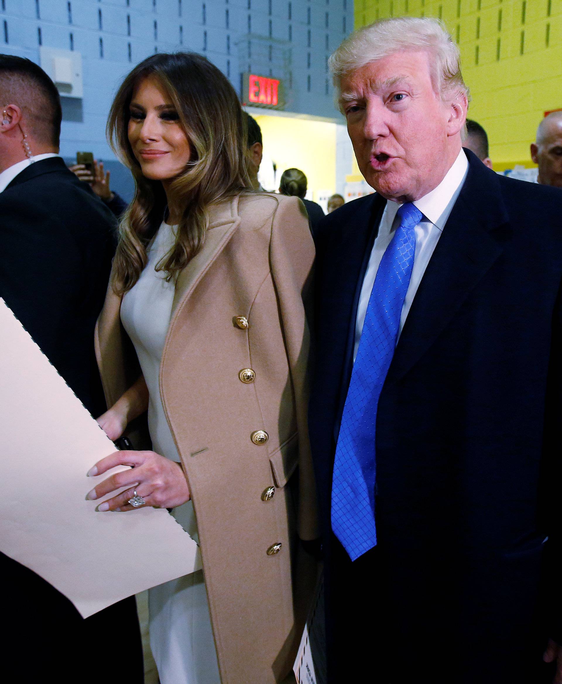 Republican presidential nominee Donald Trump and wife Melania Trump walk with their ballots to the scanner after voting at PS 59 in New York
