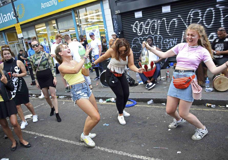 People dance during the Notting Hill Carnival in London